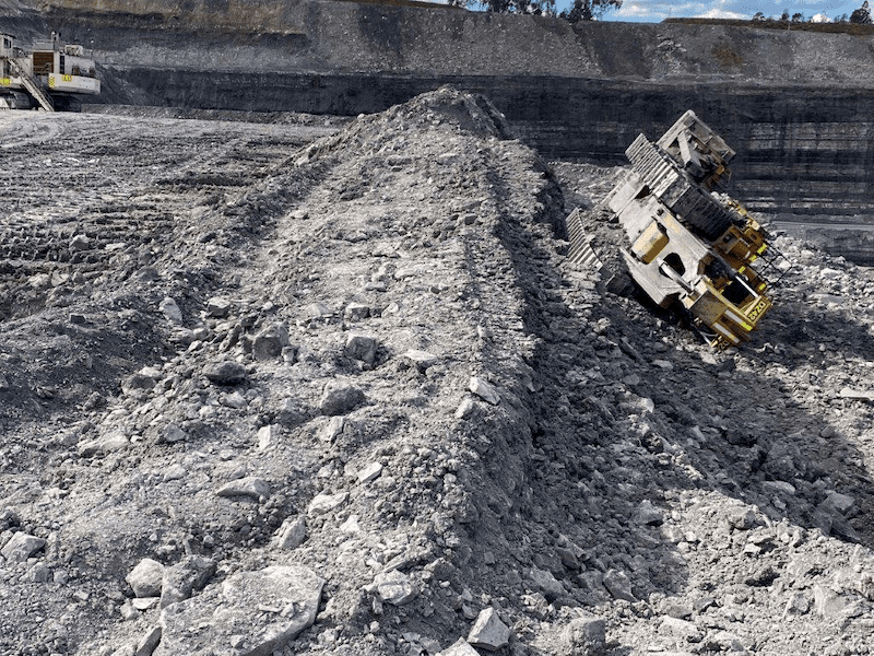 A dozer tipped over incident while levelling windrow